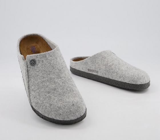 Supportive Birkenstock Zermatt slippers in light grey.