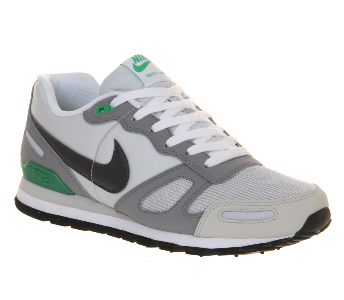 white and green nike trainers